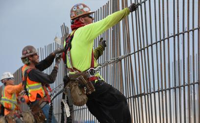 employees fixing fence